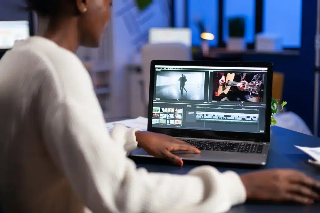 black video editor working overtime at new project editing audio film